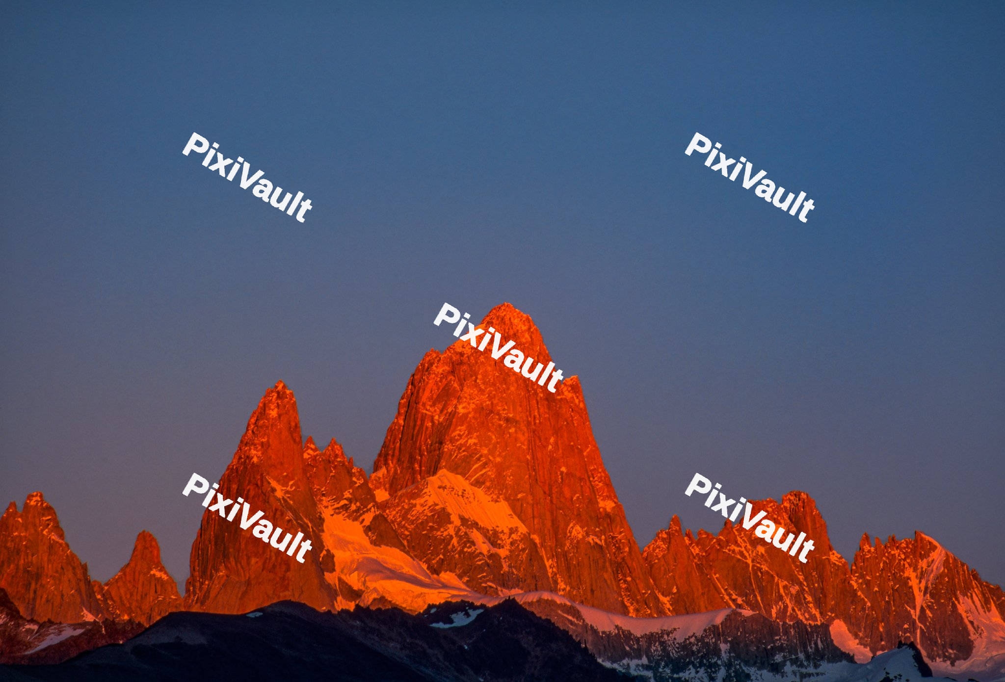 Orange mountains with blue sky